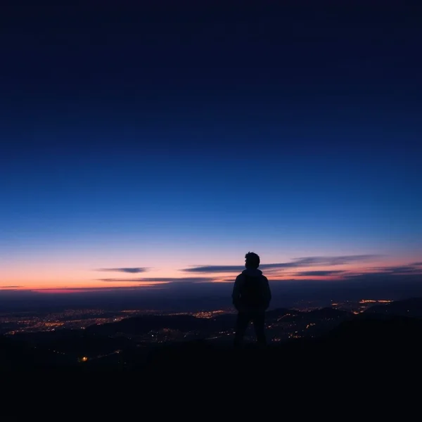 A person looking at the moon, reflecting on what has happened since that night.