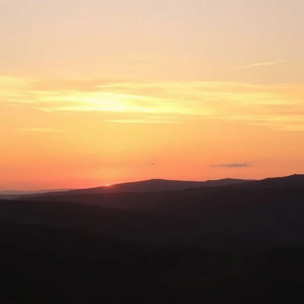 A beautiful sky at dusk over a city or landscape