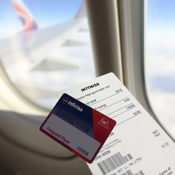 An airplane wing with text overlay reading: Understanding a frequent flyer program