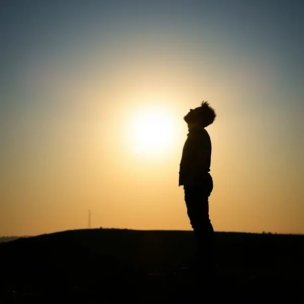 Image of a person looking hopeful with the text "Keep One's Chin Up" overlaid